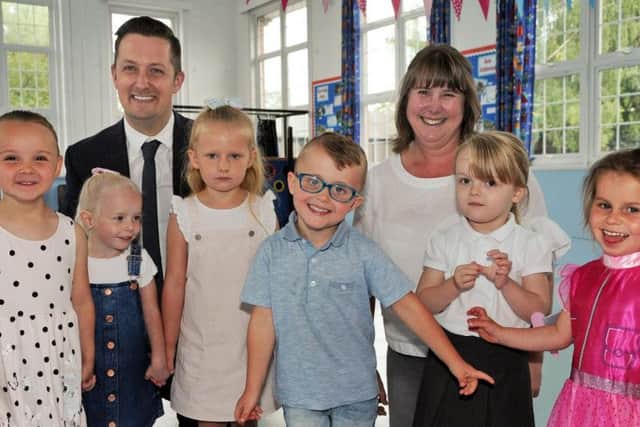 Nursery pupils from the Puffin group join the Parkgate Academy principal Mark Nunn and class teacher Amanda Clifford who are celebrating their 'Good' Ofsted report.