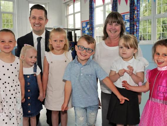 Nursery pupils from the Puffin group join the Parkgate Academy principal Mark Nunn and class teacher Amanda Clifford who are celebrating their 'Good' Ofsted report.