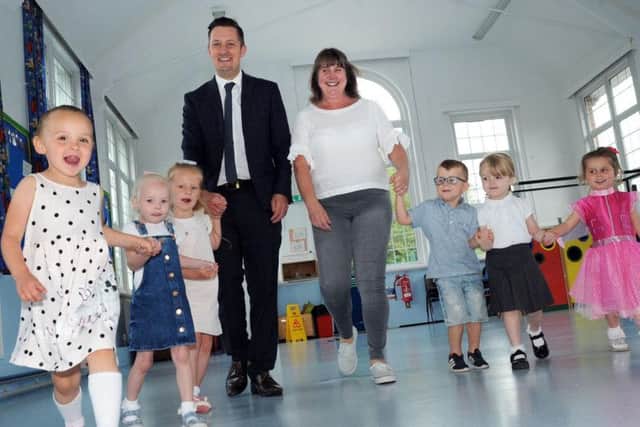 Nursery pupils from the Puffin group join the Parkgate Academy principal Mark Nunn and class teacher Amanda Clifford who are celebrating their 'Good' Ofsted report.