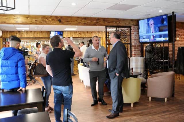 VIP guests chill at the newly-refurbished Sandy's Bar and Kitchen on Friday.