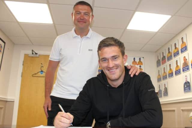 Andy Cook signs for John Dempster on Friday.