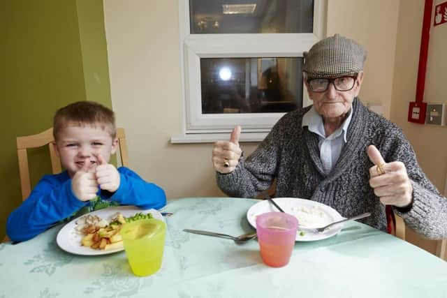 Thumbs up from four-year-old George Jackson and his grandad for the day, 93-year-old Henry Banner.