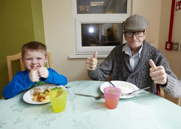 Thumbs up from four-year-old George Jackson and his grandad for the day, 93-year-old Henry Banner.