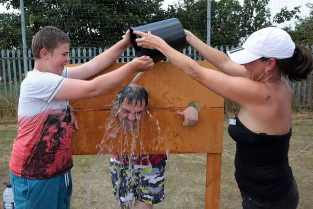 A cooling-off in the stocks for Winston White at last year's Renfest. (PHOTO BY: Glenn Ashley).