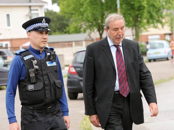 The Nottinghamshire Police and Crime Commissioner, Paddy Tipping, right, and PCSO Keith Crowhurst, pictured on their walkabout around Bilsthorpe on Monday.
