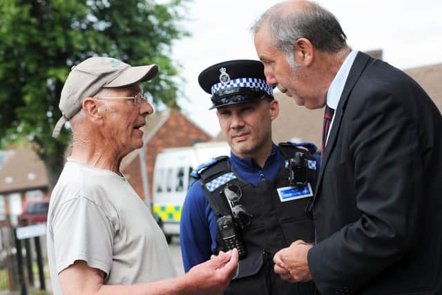 The Nottinghamshire Police and Crime Commissioner, Paddy Tipping, right, and PCSO Keith Crowhurst, chat with Bilsthorpe resident Alan Land during a walkabout around the village on Monday.