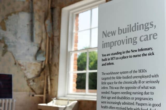 The peeling wallpaper reflects the infirmary's history