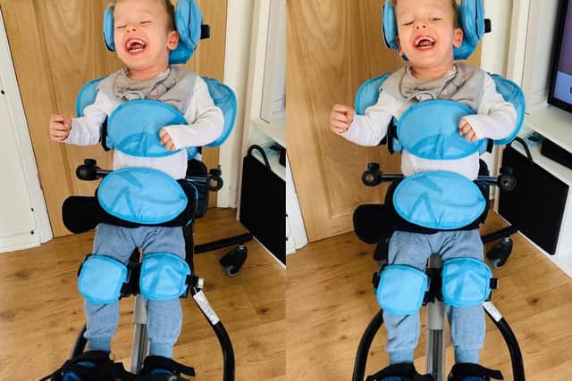 Mason Burrows, aged three in his walker