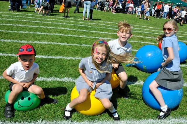 Bouncing along on the space hoppers are (from left) Luke Reynolds, Lily Reynolds, Zach Kedzior and Evie Harrison. (PHOTO BY: Louise Brimble)