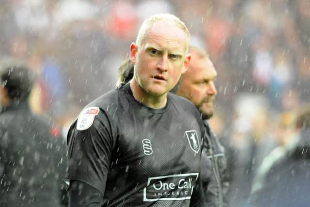 Dejection for Conrad Logan after Mansfield's defeat at MK Dons on the last day of last season.