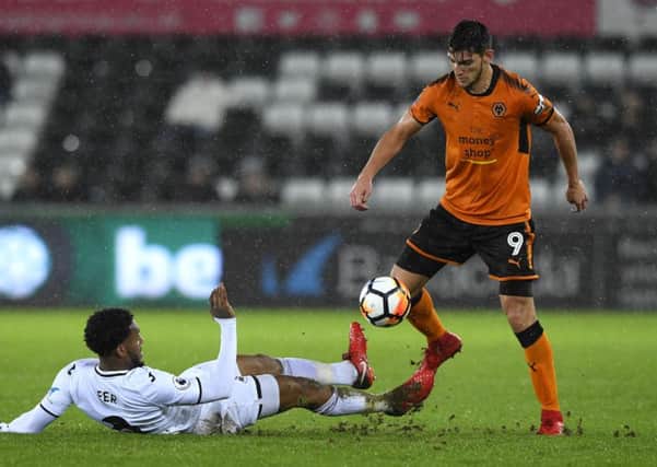 SWANSEA, WALES - JANUARY 17:  Leroy Fer of Swansea City tackles Rafa Mir of Wolverhampton Wanderers  during The Emirates FA Cup Third Round Replay between Swansea City and Wolverhampton Wanderers at Liberty Stadium on January 17, 2018 in Swansea, Wales.  (Photo by Stu Forster/Getty Images)