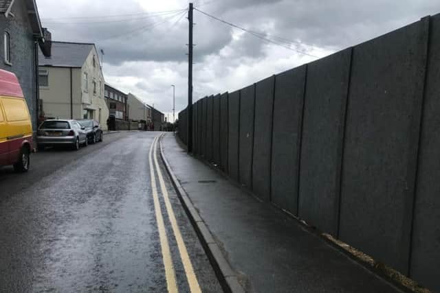 The site has been cleared and a large fence has been put up.