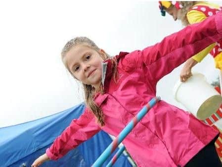 Poppy Rooney, 6, shows some skill with a hoola hoop.