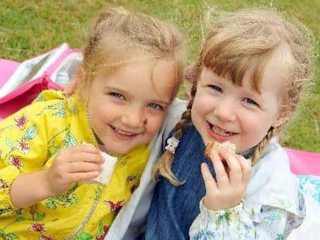 Hattie Winterton, 4 and her 3 year old pal Poppy Morris 3 enjoy a picnic lunch together.