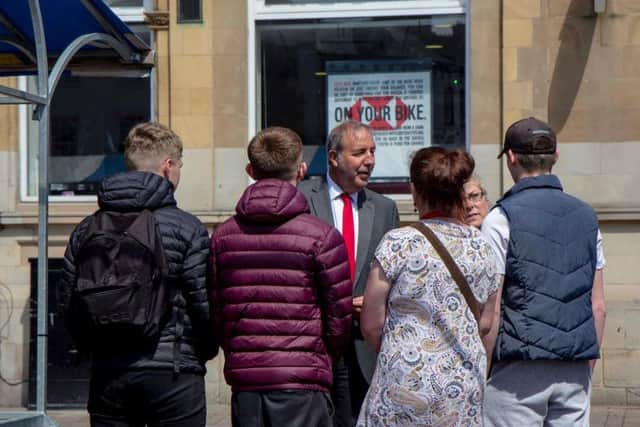 Mr Tipping speaks with residents.