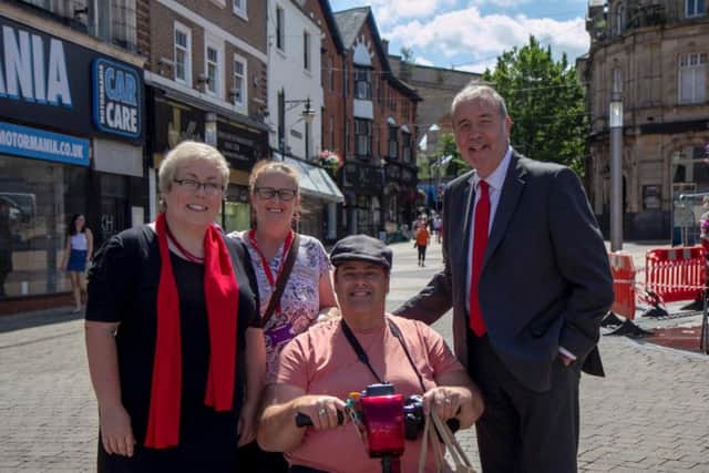 Coun Ward, Coun Fisher and Mr Tipping with a resident.