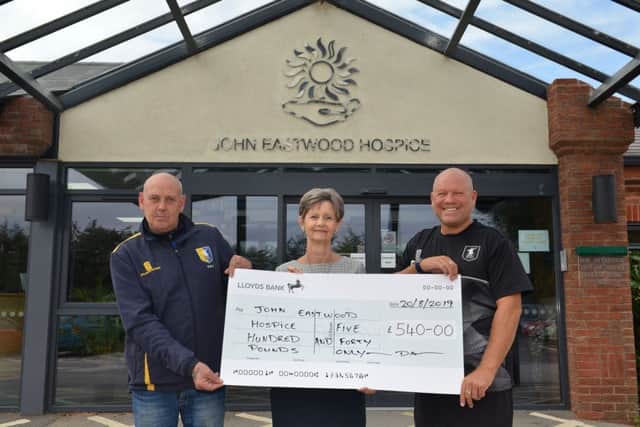 Cheque presentation to John Eastwood Hospice, money raised from charity football tournament in memory of lifelong Stags fan Michael Lojek, pictured receiving the cheque is Hospice Trust Manager Diane Humphreys with John Watson and David Butler