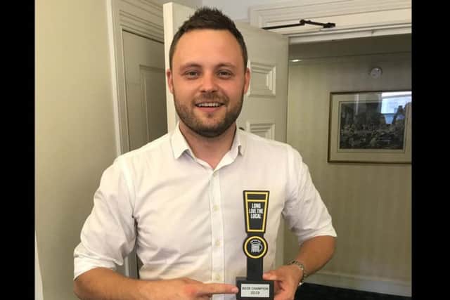 Mr Bradley with his award.