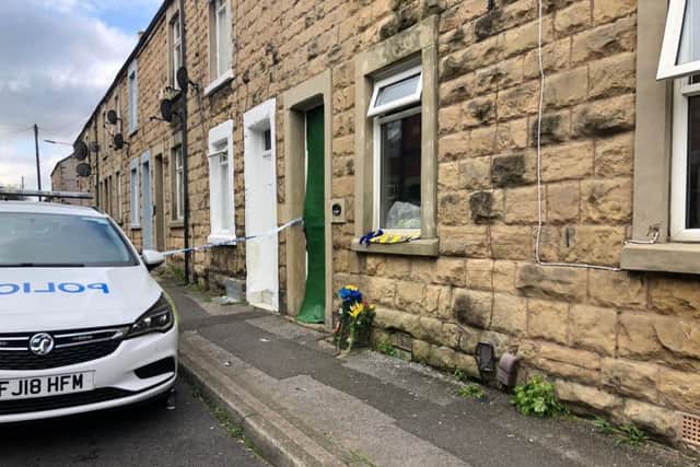 Tributes have been laid at a house in Gladstone Street