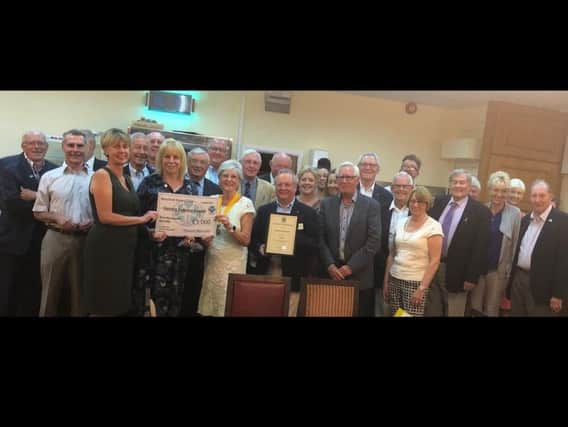 Rotary Club of Mansfield awarding the check.
