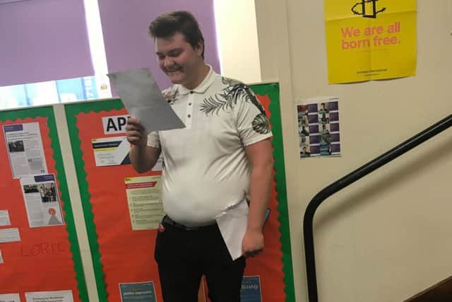 A Dukeries pupil smiles at his results.