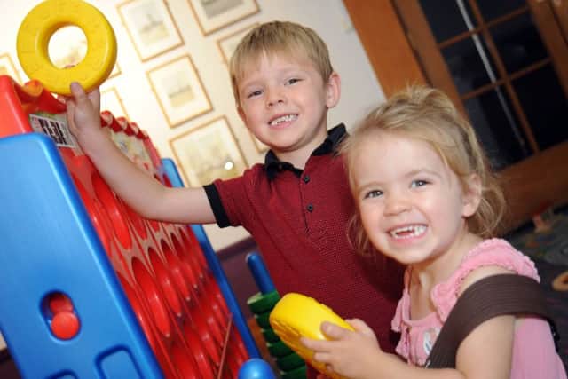Mansfield Museum are holding Toys, Games and Puzzles 
Erin Aspinall, 2 and her 5 year old brother Josh have a go on the giant oxo game in Mansfield Museum on Monday.