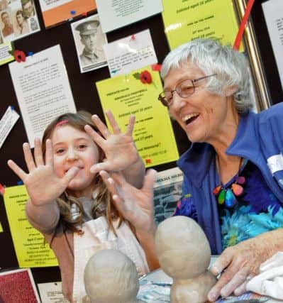 Mud heads challenge Mansfield Museum.
Team Childsplay saw Leah Childs, 5, and Grandma Ann Childs from Mansfield, work their clay into each other's likeness.