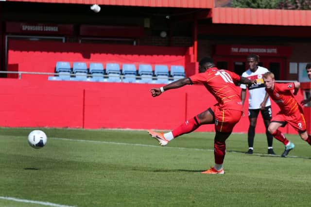 Alfreton's Amari Morgan-Smith fires in the penalty.