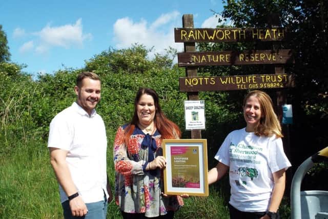 James Miles and Kate Summerfield-Breeze of Kingfisher Lighting being presented their certificate by Holly McCain (right) from Nottinghamshire Wildlife Trust.