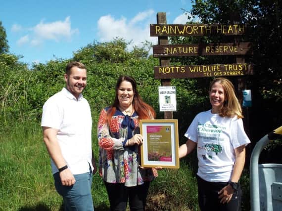 James Miles and Kate Summerfield-Breeze of Kingfisher Lighting being presented their certificate by Holly McCain (right) from Nottinghamshire Wildlife Trust.