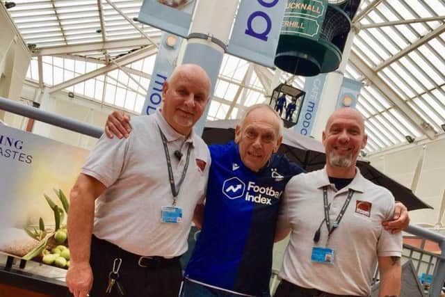 Malcolm Burrows (centre) with hero Idlewells staff Jason Ingram and Neil Thompson.