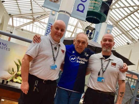 Malcolm Burrows (centre) with hero Idlewells staff Jason Ingram and Neil Thompson.