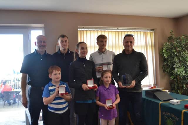 Winning team with gold medal presentation, Tony Tomlinson Club PGA pro, Callum Barlow, Coaching Assistant, Gary Pritchard Tournament Sponsor and winning team with their gold medals.