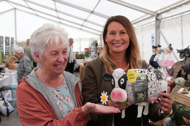Janet Saunders is tempted by Rachel Lee's Ermyntrude cow.