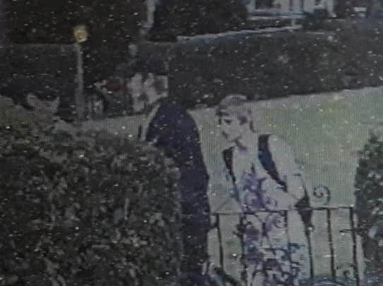 Do you recognise the man in the black cap?