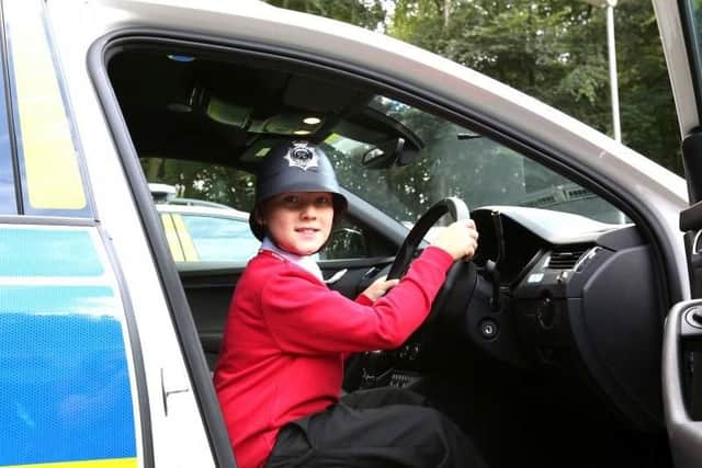 Rufus had the chance to sit in a police car