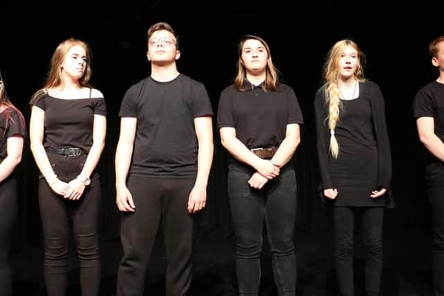 Year one performing arts students during a performance about democracy.