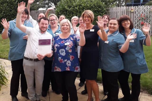 Staff at the care home celebrate the 'Good' overall rating.