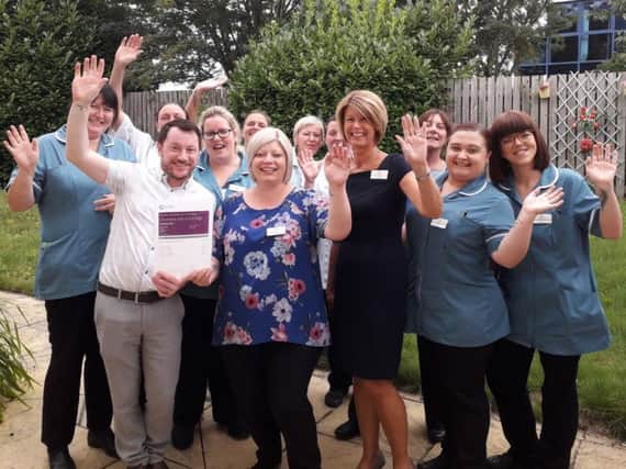 Staff at the care home celebrate the 'Good' overall rating.