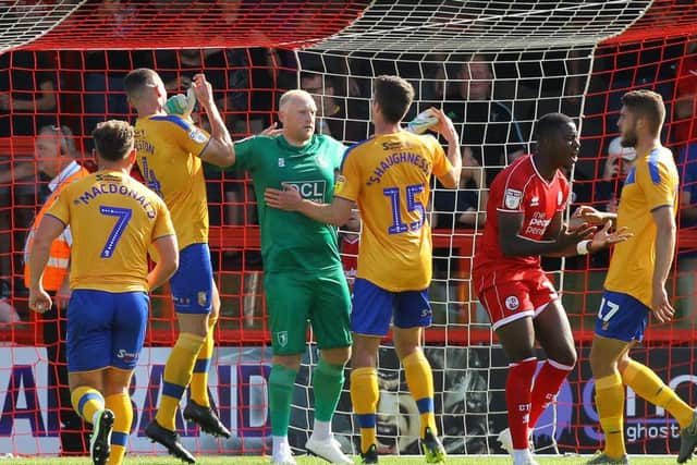 Picture Gareth Williams/AHPIX LTD, Football, Sky Bet League Two, Crawley Town v Mansfield Town, Checkatrade.com Stadium, Crawley, UK, 14/09/19, K.O 3pm
Howard Roe>07973739229
Mansfield keeper Conrad Logan accepts the congratulations of his team mates after his penalty save from Crawley's Bez Lubala