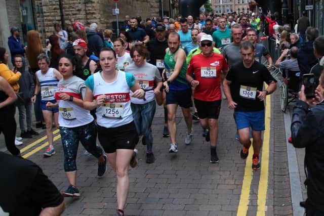 Runners start off on the 10K run.