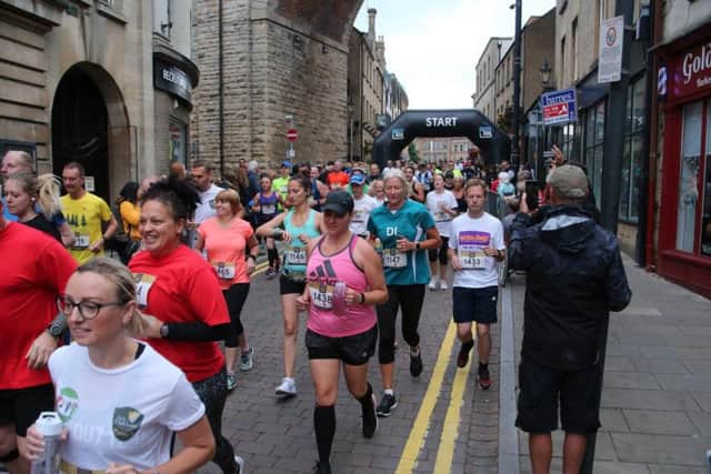Runners start off on the 10K run.