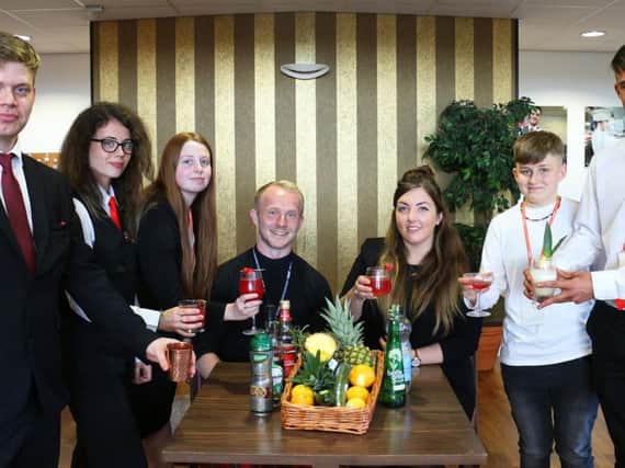 Students presenting some of the new cocktails they created