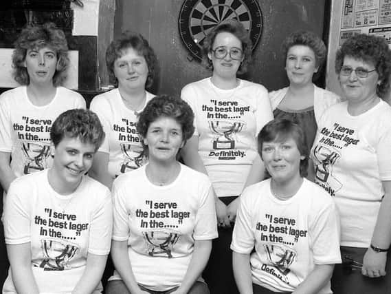 1986: This smiley bunch look ready to win their next match, they play for Bridge Taverns ladies darts team. Did you play for this pub?