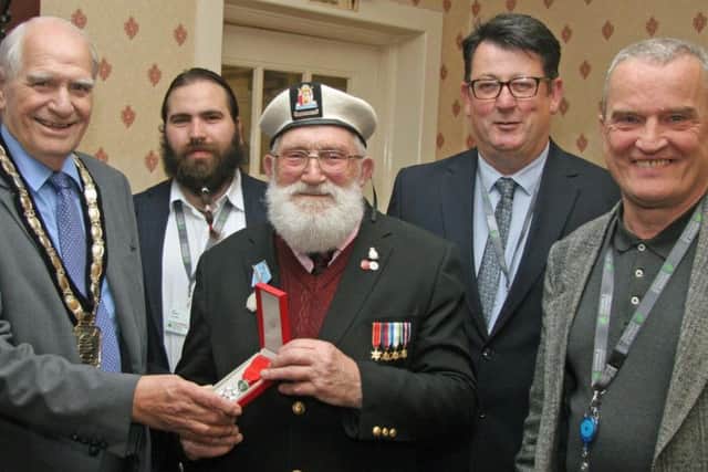 Reg Taylor with his Legion d'honneur medal and Chair of Newark and Sherwwod district councillor Rob Crowe and Cllr Lee Brazier,Cllr  Paul Peacock and Cllr Bruce Laughton.
