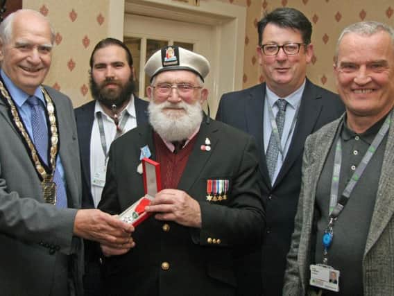 Reg Taylor with his Legion d'honneur medal and Chair of Newark and Sherwwod district councillor Rob Crowe and Cllr Lee Brazier,Cllr  Paul Peacock and Cllr Bruce Laughton.