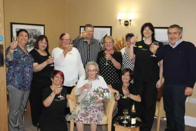 Baily House staff celebrating its first ever resident a few years ago.