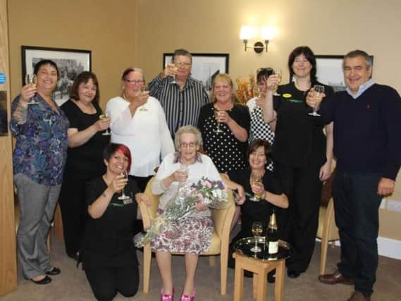 Baily House staff celebrating its first ever resident a few years ago.