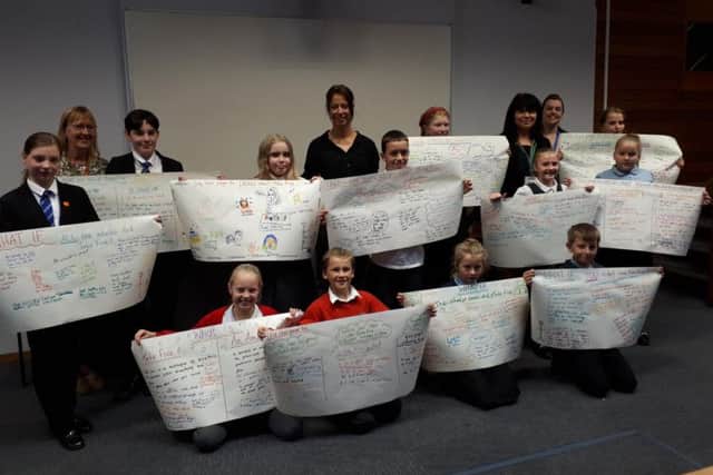 Ms De Piero with the school children.