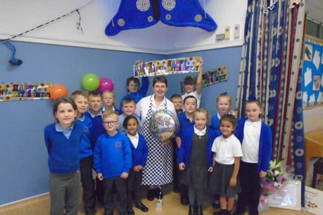 Janet Bennett with the school children.